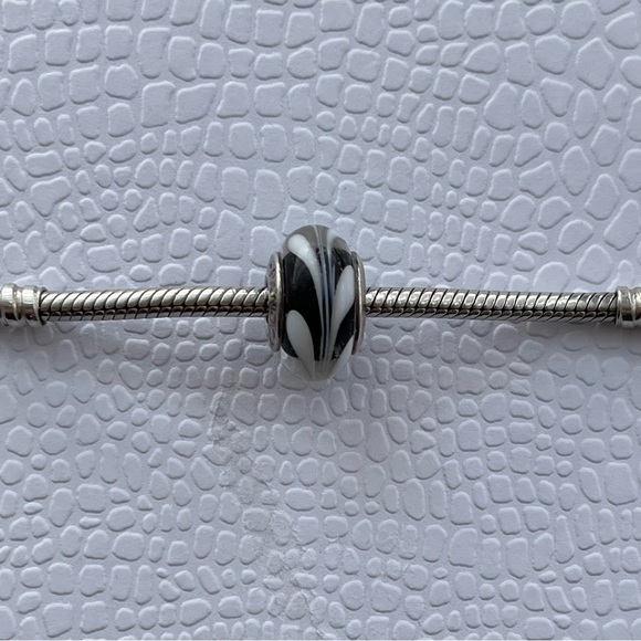 Pandora Jewelry - Authentic Retired Pandora Swirls Black and White Murano Glass Charm